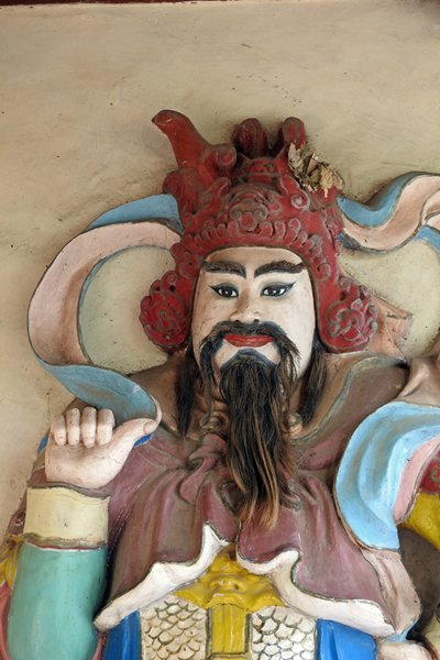 Beeld bij de Thien Mu pagode met echt haar, Hué (Vietnam)